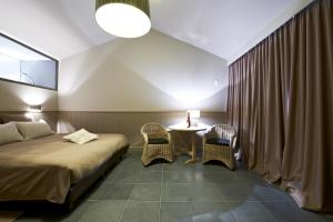 Tempat tidur dalam kamar di Tannine et Cuisine