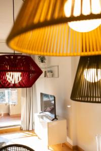 two red and yellow lights in a living room at SingularStays Palacio de Congresos in Valencia