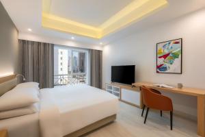 Sjónvarps- og/eða afþreyingartæki á Marriott Executive Apartments City Center Doha