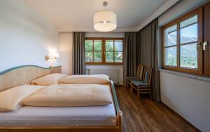 Posteľ alebo postele v izbe v ubytovaní Landhaus Bellevue