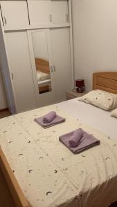 Postel nebo postele na pokoji v ubytování Apartmani Ema & Lana