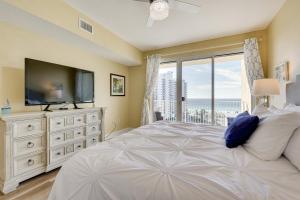 A bed or beds in a room at Miramar Beach Getaway with Balcony and Ocean View!