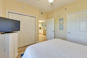 A television and/or entertainment centre at Miramar Beach Getaway with Balcony and Ocean View!