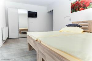 Postel nebo postele na pokoji v ubytování Hotel Duwakschopp