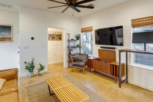 a living room with a flat screen tv and a couch at Stylish Austin Home with Hot Tub 3 Mi to Downtown! in Austin