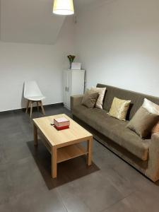 a living room with a couch and a coffee table at Casa Rosa1 in Valle de Abdalagís