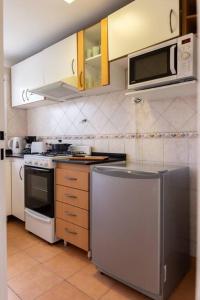 Kuchyň nebo kuchyňský kout v ubytování Centenario 1051 by depptö BAJA