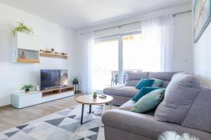 Televízia a/alebo spoločenská miestnosť v ubytovaní Silvija Holiday Home