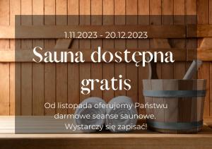 a sign for a sauna in a wooden wall at Willa Brygida Spa in Kudowa-Zdrój