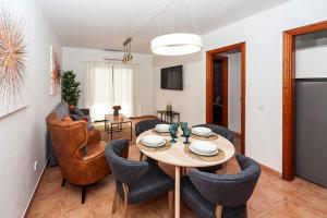a living room with a table and chairs at Luxury Suite Ocean Views in Tías