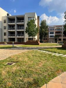 a large building in front of a field of grass at Marble nights in Johannesburg +20 photos