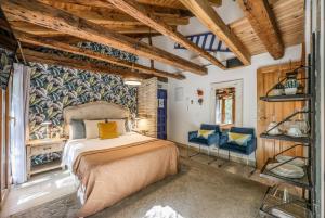 En eller flere senge i et værelse på Apartamento Plaza de España 7