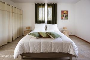 Voodi või voodid majutusasutuse Villa Sweet Caraïbes, vue mer, jacuzzi toas