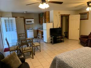 a kitchen and living room with a table and a dining room at Holly Park Marina in Milam