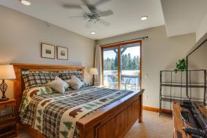 a bedroom with a bed with a ceiling fan at Condo with King Bed 3 Mi to Breckenridge Gondola! in Breckenridge