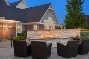 a patio with a fire pit in front of a house at Residence Inn by Marriott Madison West/Middleton in Middleton