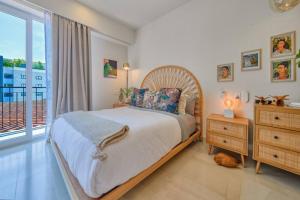 a bedroom with a bed and a large window at Cozy 1Br Apt - Pool - GYM in Bucerías +35 photos