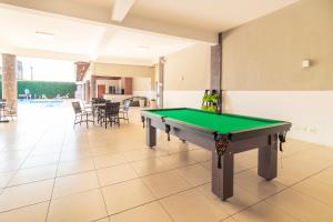 a pool table in the middle of a room at Luz Hotel by Castelo Itaipava in Foz do Iguaçu +28 photos