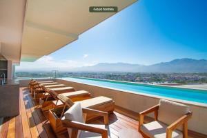 a view of a pool from a hotel room at Apt w/2 beds - Private Balcony - Infinity Pool in Puerto Vallarta