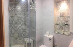 a bathroom with a shower with a toilet and a sink at home & room center of rabat in Rabat +21 photos