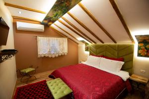 Postel nebo postele na pokoji v ubytování Vila Eden Boutique Hotel