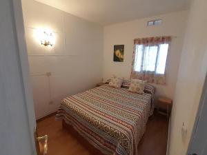 a bedroom with a bed and a window at Paraiso in Tacoronte +12 photos