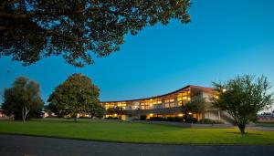 an exterior view of a building at night at Kennedy Park Resort Napier in Napier