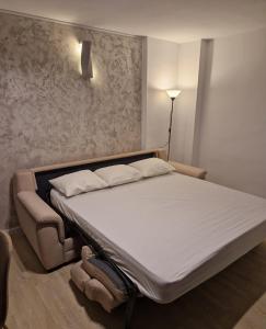 a bed in a room with a white mattress at Old Town 1 st floor, near the beach in Benidorm
