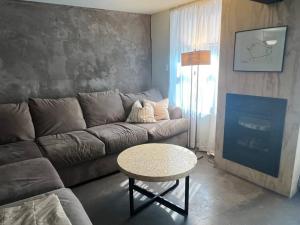 a living room with a couch and a table at Unique Style Apartment in Asbury Park