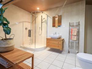 a bathroom with a shower and a sink and a toilet at The Bowery in Ambleside