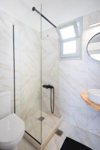 a bathroom with a shower with a toilet and a sink at Navi A1 Brand new Studio in Naousa in Naousa