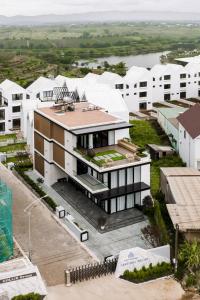 an aerial view of a building with white buildings at LAKEHILL Villas in Bao Loc