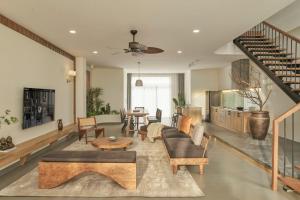 a living room with a couch and a table at LAKEHILL Villas in Bao Loc