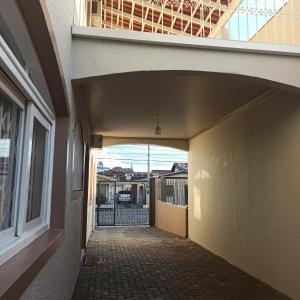 an empty hallway of a building with a balcony at Hostel na Rota da Serra Gaúcha in Taquara