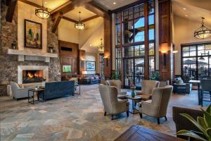 a lobby with couches and a fireplace at Grand Lodge on Peak 7 in Breckenridge