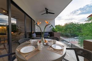 a dining room with a table with a view at 3022 - Ziba Condo 203 in Santa Cruz Huatulco
