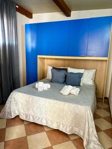 מיטה או מיטות בחדר ב-Case vacanze ''Estremo Sud'' Lampedusa