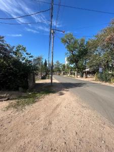 an empty street with a pole on the side of the road at La Pintada Economy Class in Villa Dolores