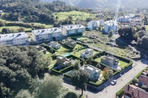 an aerial view of a city with buildings at helloasturias, Casa en Llanes con piscina, jardín, cerca de la playa. in Llanes