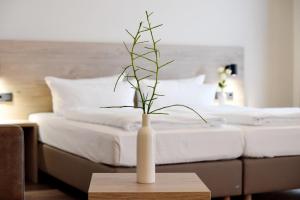 Postel nebo postele na pokoji v ubytování DiMas Hotel Ettenheim - Rust