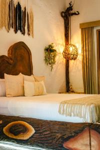 מיטה או מיטות בחדר ב-ANZALIK HOTEL BOUTIQUE