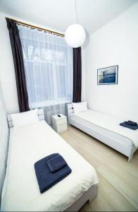 Posteľ alebo postele v izbe v ubytovaní Atlas Hotel