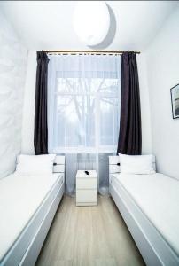 Posteľ alebo postele v izbe v ubytovaní Atlas Hotel