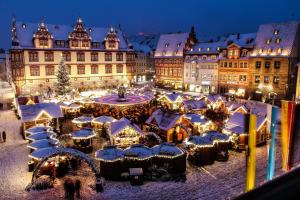 a christmas market in a city at night at Unsere neue Ferienwohnung Hereinspaziert 