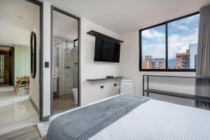 Postel nebo postele na pokoji v ubytování Apartamentos HOUSY Laureles