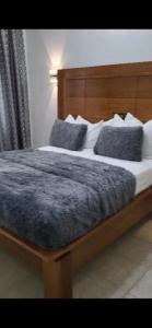 En eller flere senge i et værelse på JAD HOTEL Dschang