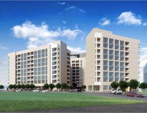 un gran edificio blanco con coches estacionados frente a él en DoubleTree by Hilton Doha Downtown, en Doha