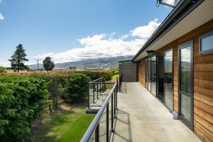 a balcony of a building with a view of a mountain at Falcon's Nest in Cromwell