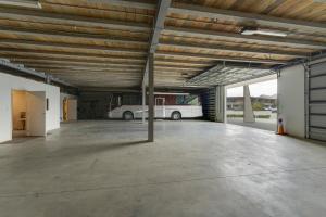 an empty parking garage with a bus parked in it at Falcon's Nest in Cromwell