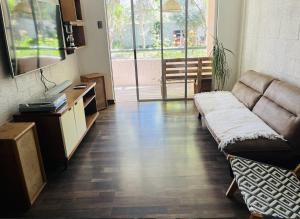 a living room with a couch and a table at Departamento Refaccionado y centrico in Vicuña